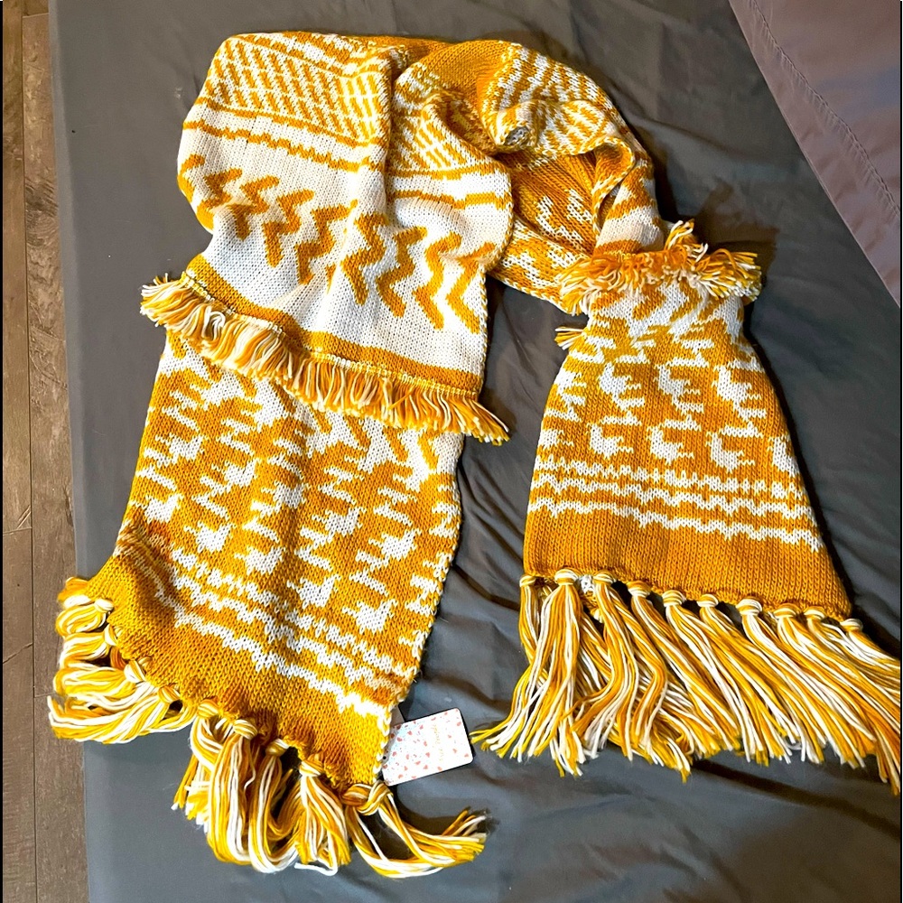 Free People shawl never worn. Can be worn as a snuggly winter scarf as well.
